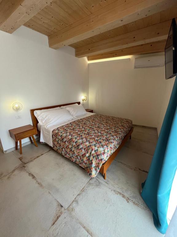 Postel nebo postele na pokoji v ubytování De LoCa Rooms
