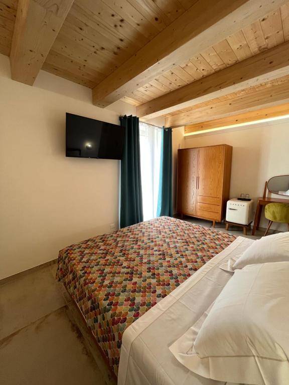 Postel nebo postele na pokoji v ubytování De LoCa Rooms