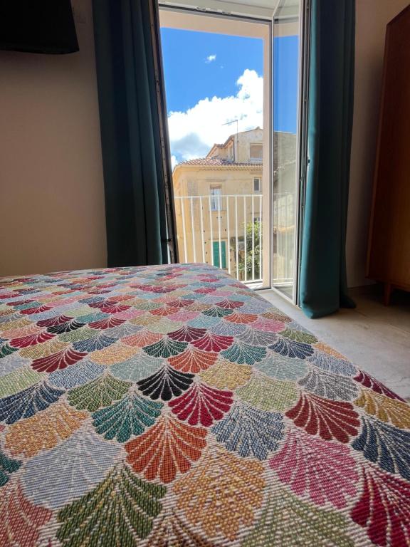 Postel nebo postele na pokoji v ubytování De LoCa Rooms