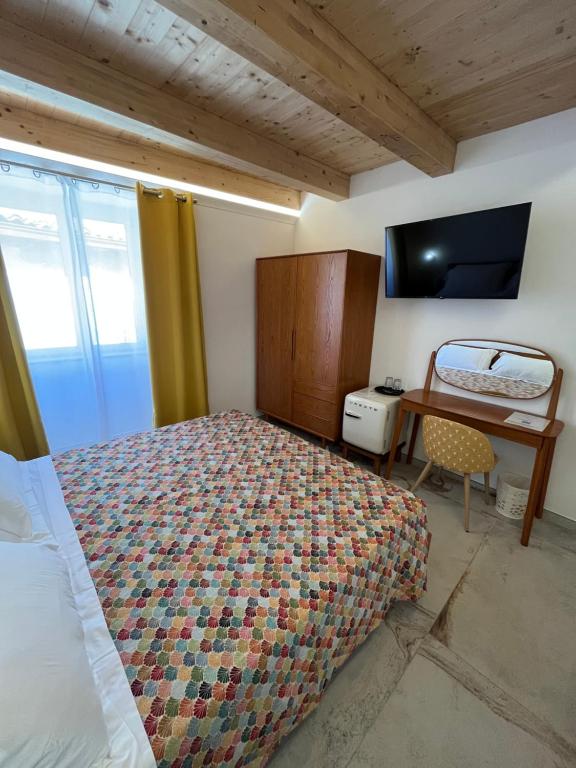 Postel nebo postele na pokoji v ubytování De LoCa Rooms