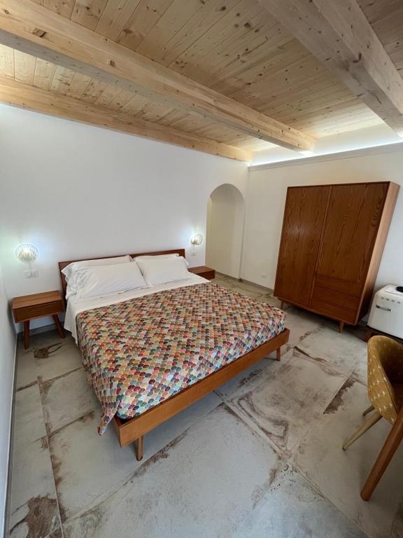 Postel nebo postele na pokoji v ubytování De LoCa Rooms