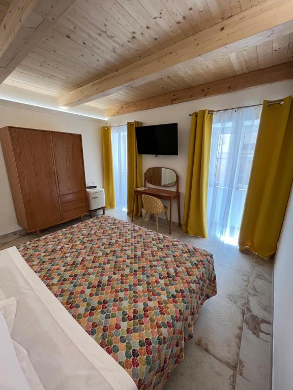 Postel nebo postele na pokoji v ubytování De LoCa Rooms