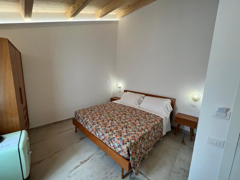 Postel nebo postele na pokoji v ubytování De LoCa Rooms
