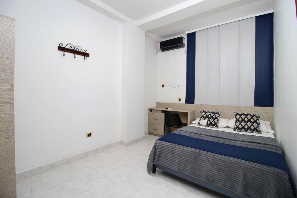 Postel nebo postele na pokoji v ubytování Hotel Emberá