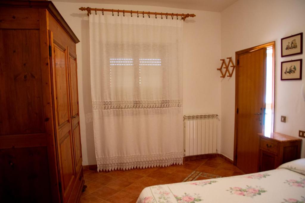 Łóżko lub łóżka w pokoju w obiekcie Agriturismo Campo Contile