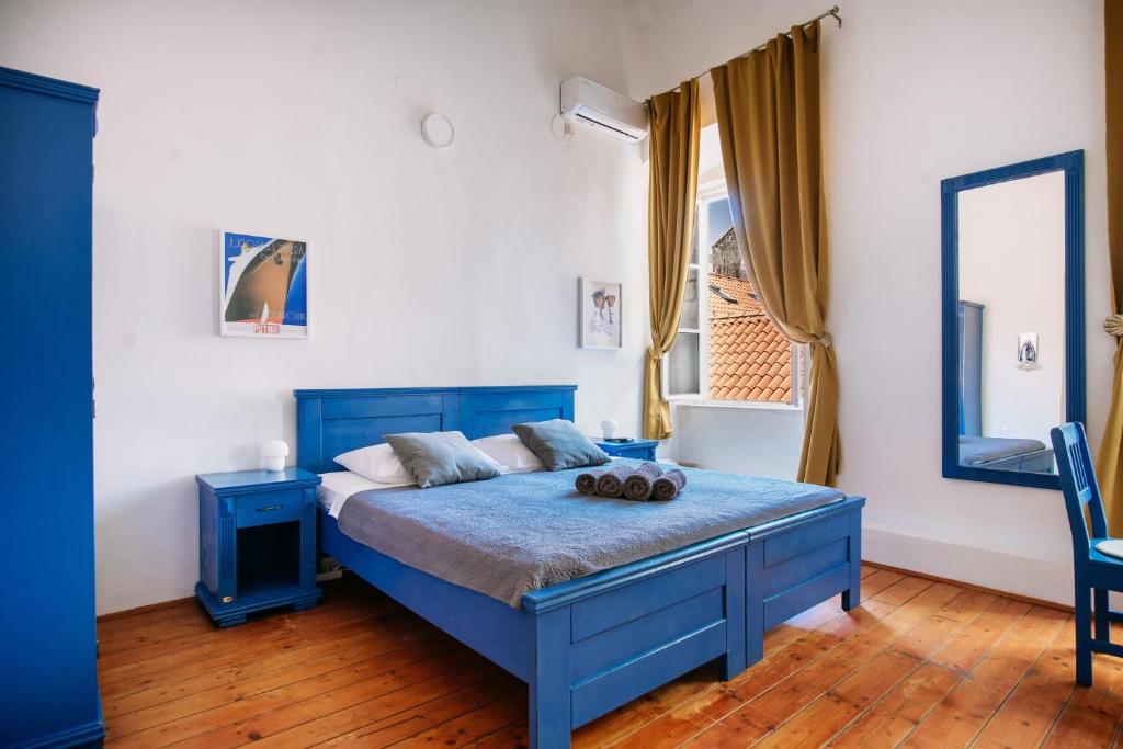 Posteľ alebo postele v izbe v ubytovaní LE MURA OLD TOWN APARTMENT by DuHomes