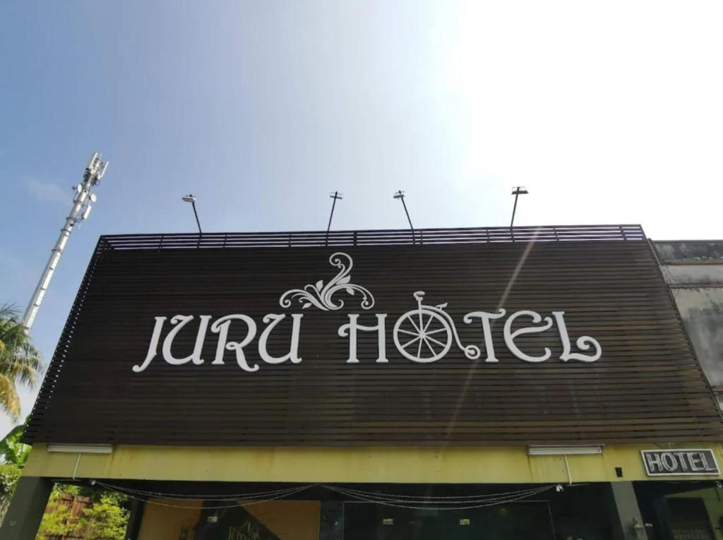 a sign on the top of a jjad hotel at Juru Hotel in Bukit Mertajam