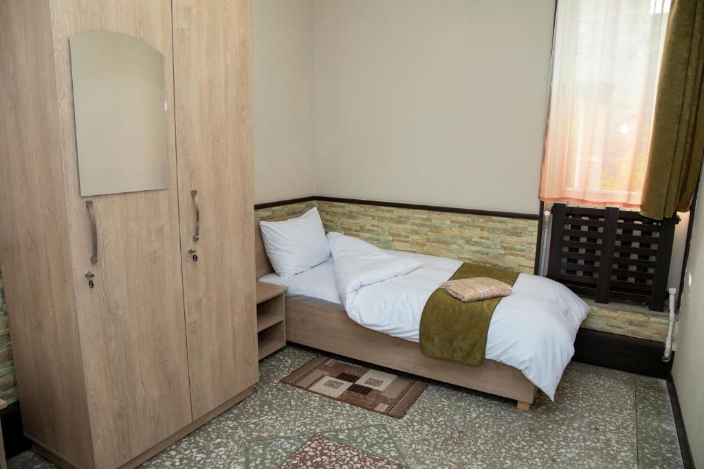Postel nebo postele na pokoji v ubytování ASA Hotel
