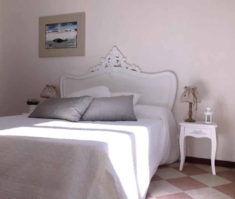 Łóżko lub łóżka w pokoju w obiekcie Hotel Villa San Fedele