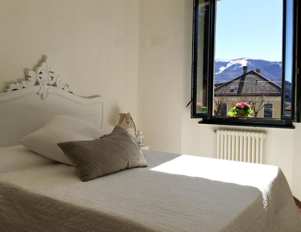 Łóżko lub łóżka w pokoju w obiekcie Hotel Villa San Fedele