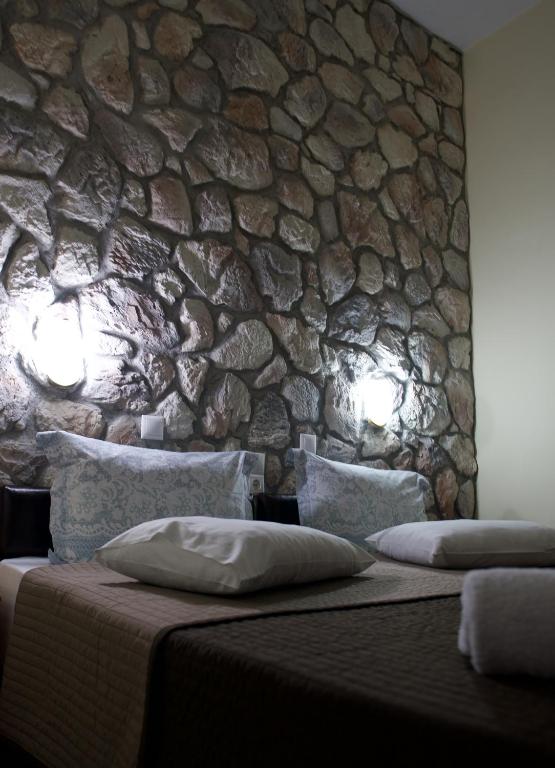 Posteľ alebo postele v izbe v ubytovaní Rooms Batalogianni
