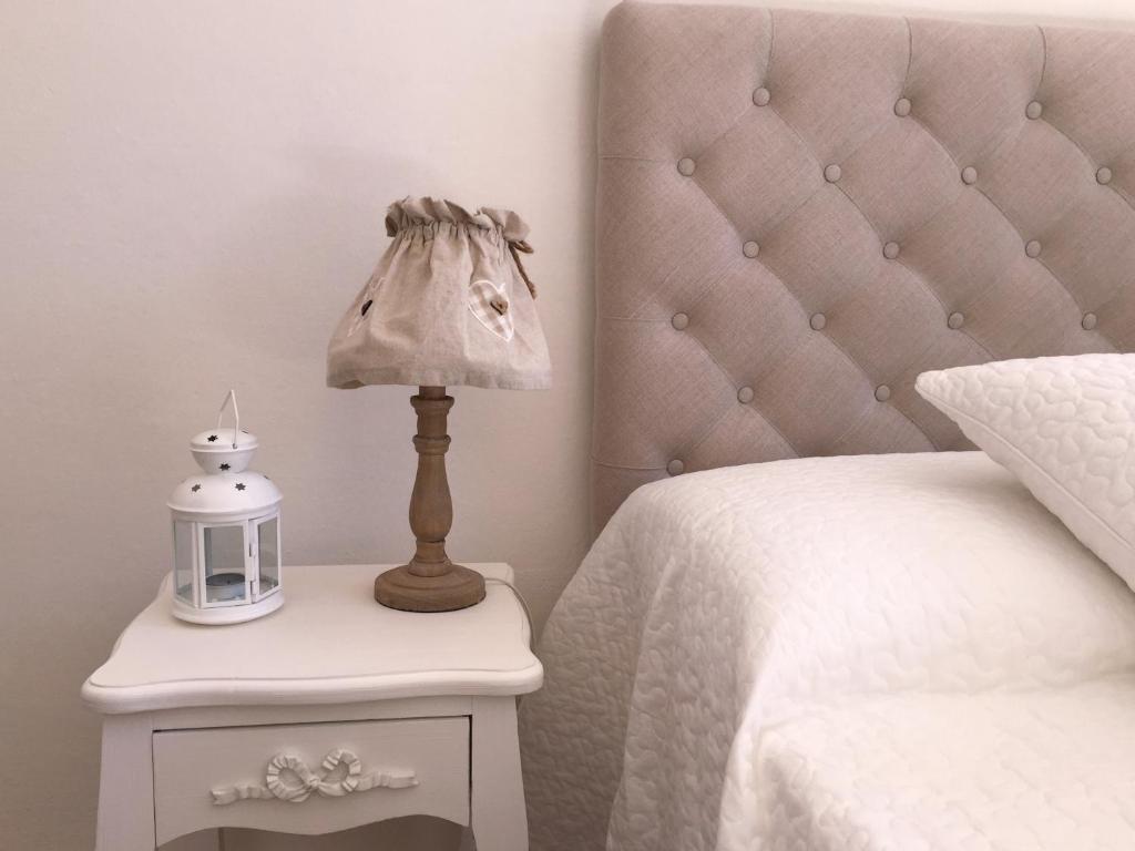 Łóżko lub łóżka w pokoju w obiekcie Hotel Villa San Fedele