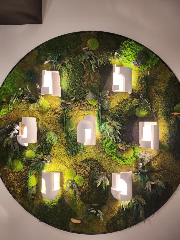 a circle with lights in the middle of a room at Hôtel Restaurant BO &amp; MIA in La Baule