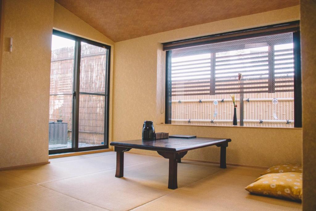a room with a table in front of a window at WASEIDOU ZEN - Vacation STAY 19515v in Kobe