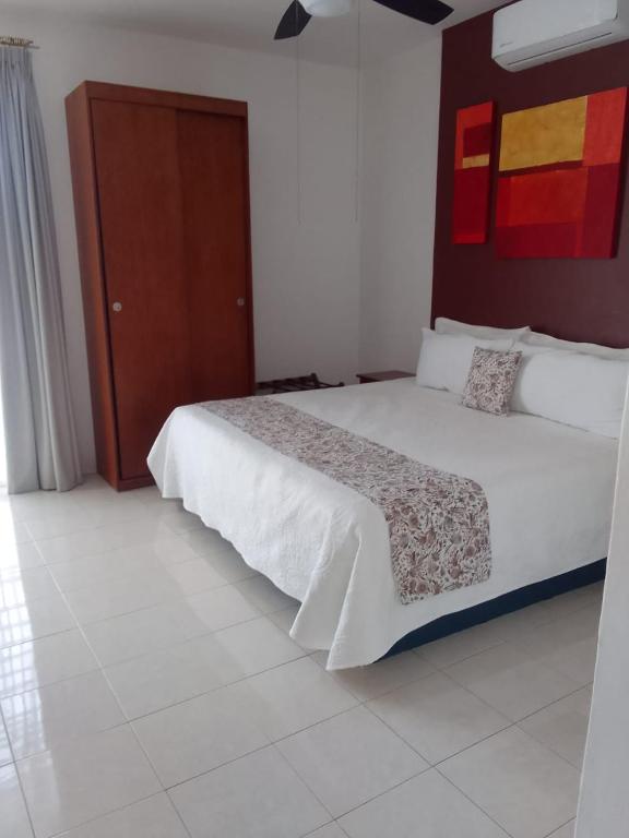 Postel nebo postele na pokoji v ubytování Hotel Real Villa
