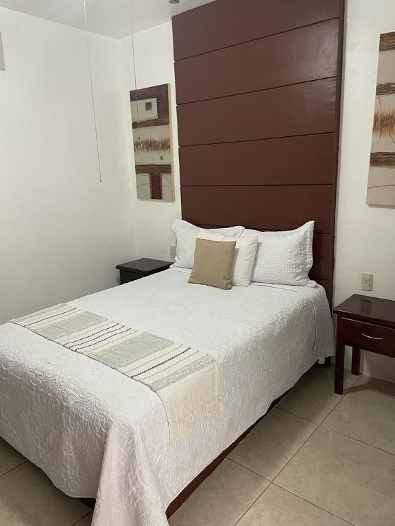 Postel nebo postele na pokoji v ubytování Hotel Real Villa
