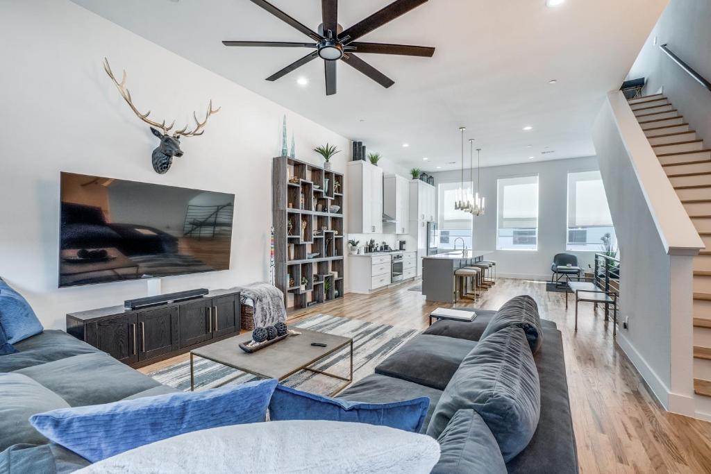 a living room with a couch and a table at Close to Uptown / Downtown in Dallas