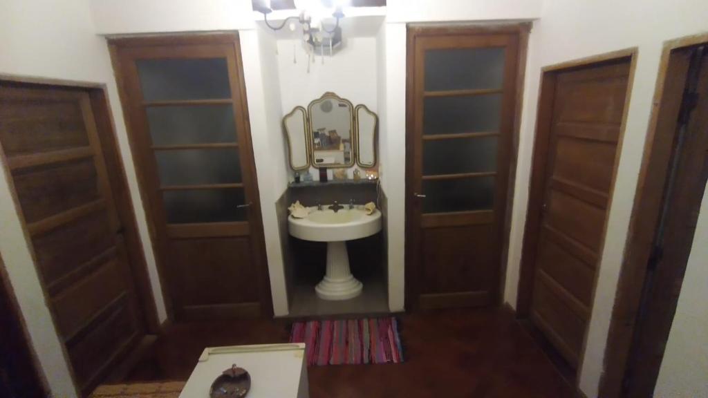 a bathroom with a sink and a mirror at Casa Funes in Funes
