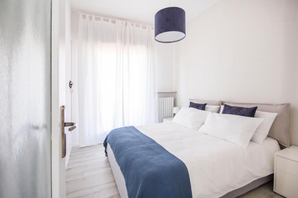 Ένα ή περισσότερα κρεβάτια σε δωμάτιο στο Cucciolina Home Como Lake