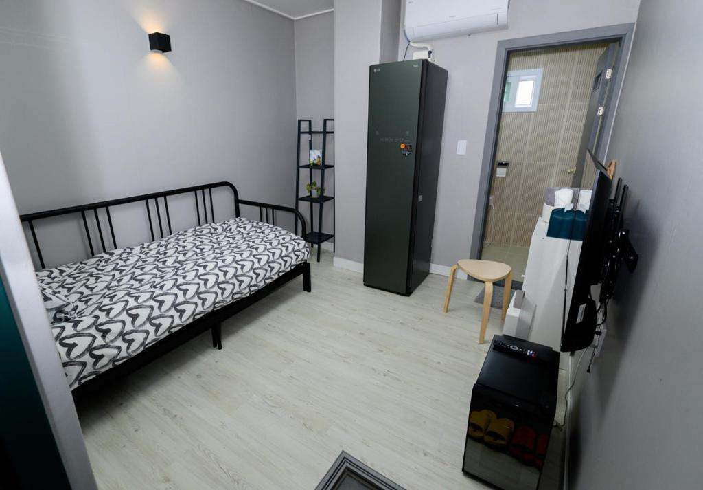 Postel nebo postele na pokoji v ubytování Aha Stay