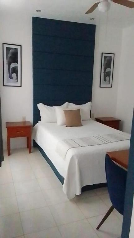 Postel nebo postele na pokoji v ubytování Hotel Real Villa
