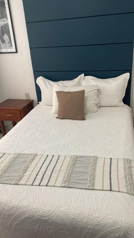 Postel nebo postele na pokoji v ubytování Hotel Real Villa