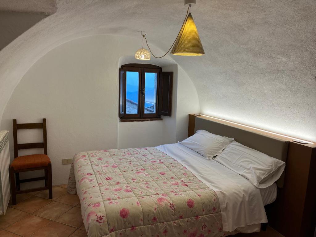 Postel nebo postele na pokoji v ubytování La Taberna di Rocca Calascio