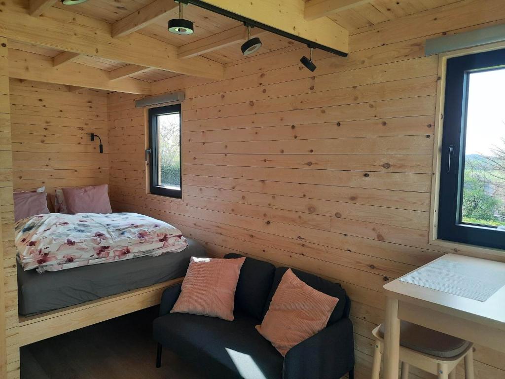 Postel nebo postele na pokoji v ubytování La roulotte de Soiron