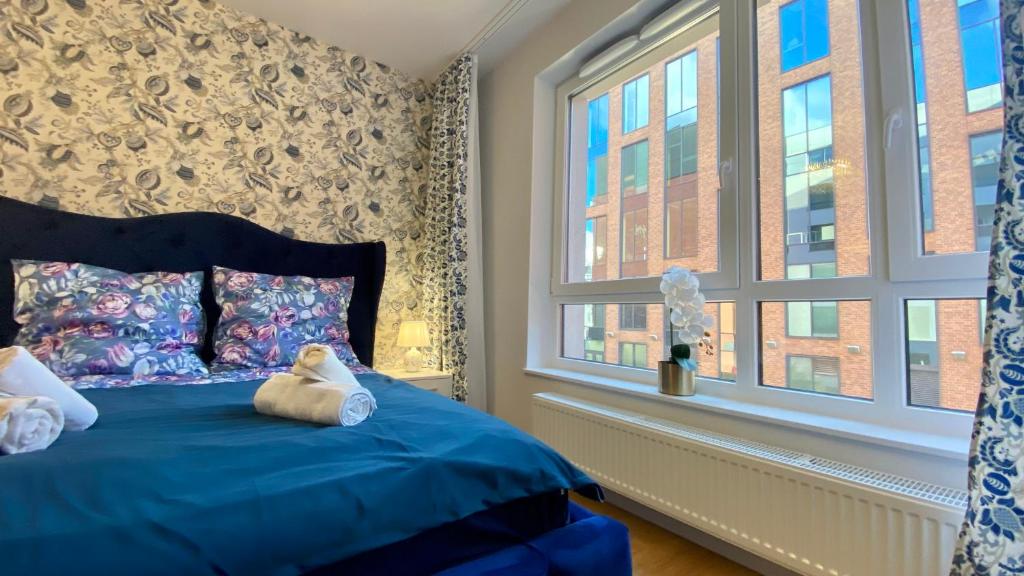 Posteľ alebo postele v izbe v ubytovaní Apartament Long Island Gdańsk