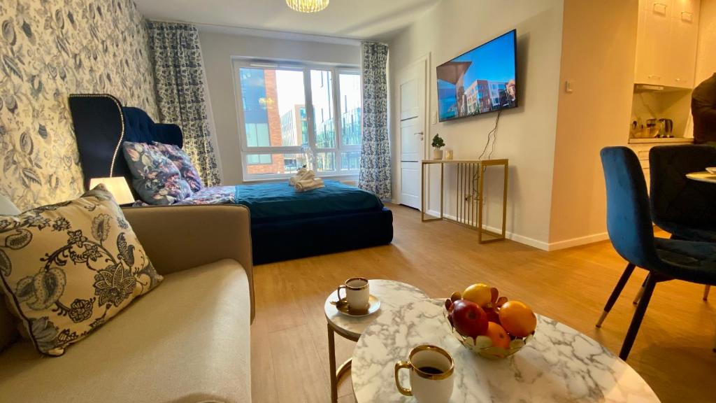 Televízia a/alebo spoločenská miestnosť v ubytovaní Apartament Long Island Gdańsk