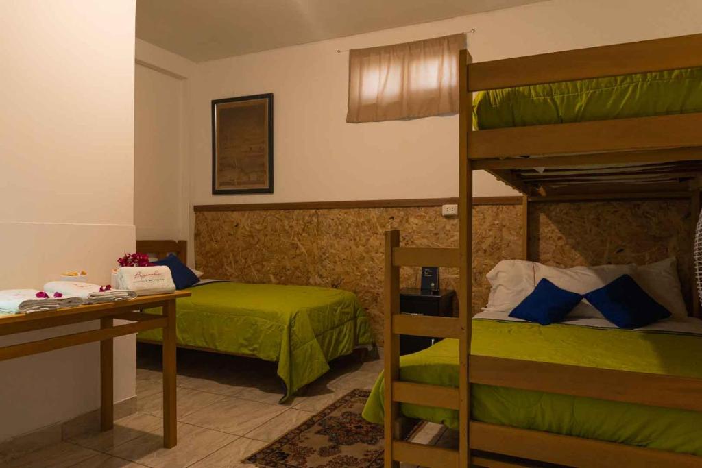 Postel nebo postele na pokoji v ubytování BUGANVILIA