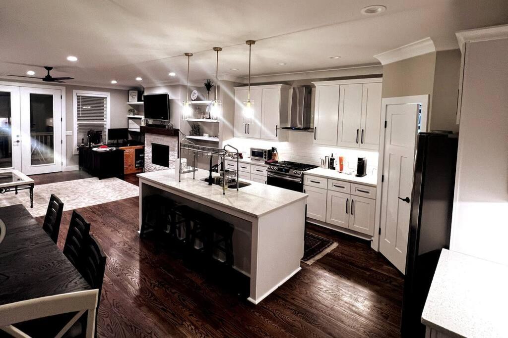 a kitchen with white cabinets and a white counter top at 7 Min from Broadway! 3 Bed 2.5 Bath (Sleeps 10+) in Nashville