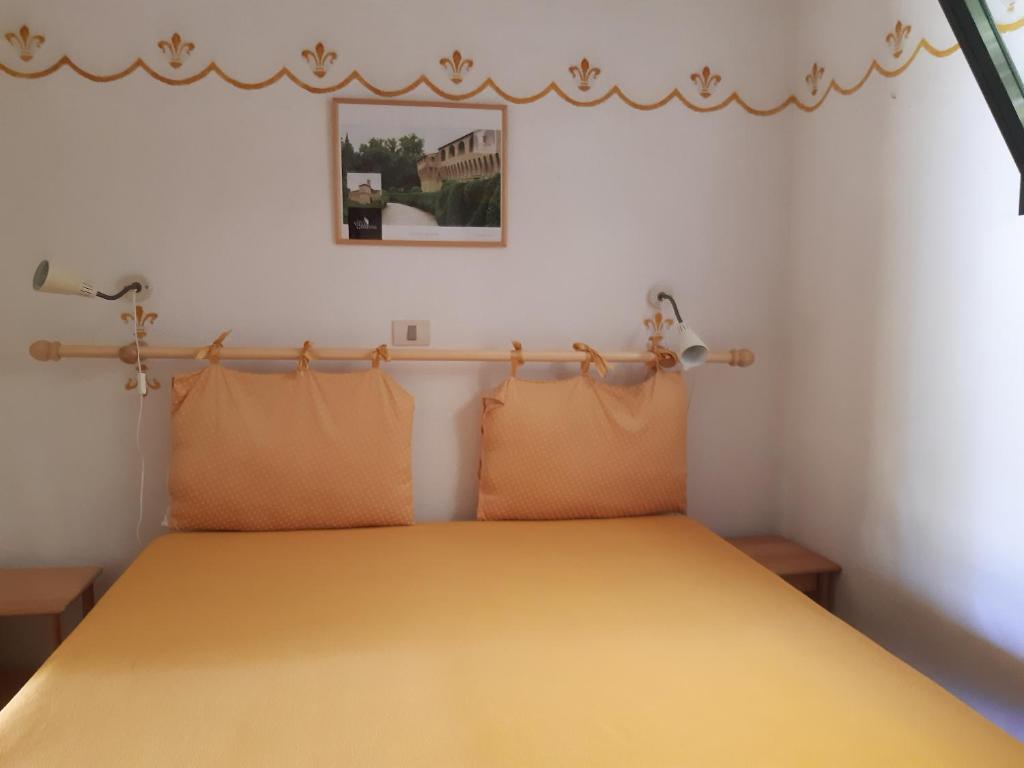 Postel nebo postele na pokoji v ubytování Rio Verde camping villaggio