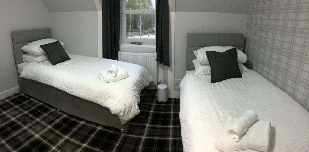 Postel nebo postele na pokoji v ubytování Glenshee Guest House
