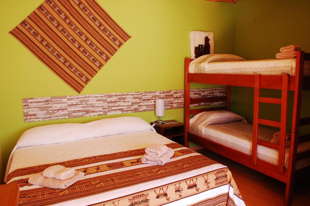 Postel nebo postele na pokoji v ubytování Hostal Pablito