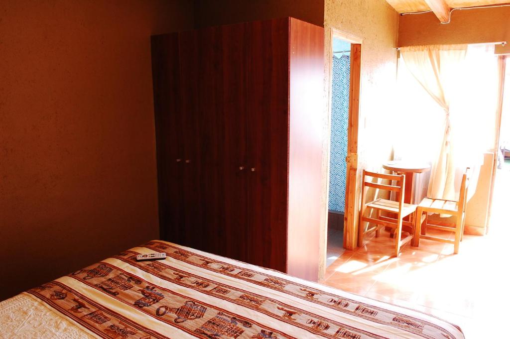 Postel nebo postele na pokoji v ubytování Hostal Pablito