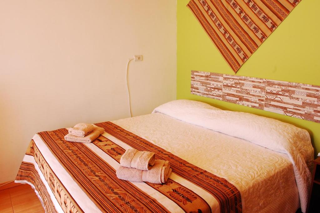 Postel nebo postele na pokoji v ubytování Hostal Pablito