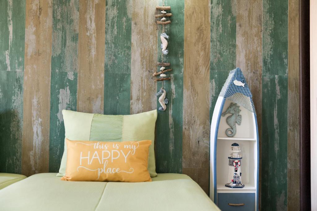 a bed with a pillow that says this is my happy place at HC Torreira Beach in Torreira