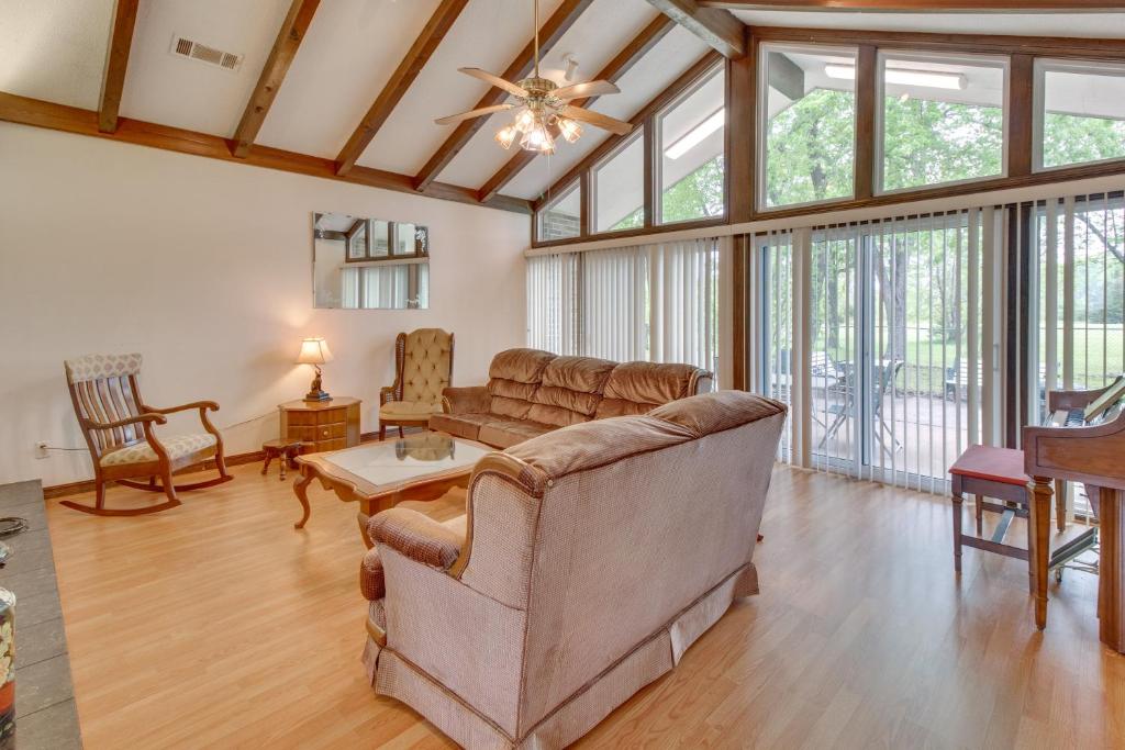 a living room with a couch and a table at Gassville Home 3 Mi to White River and Trout Fishing in Gassville