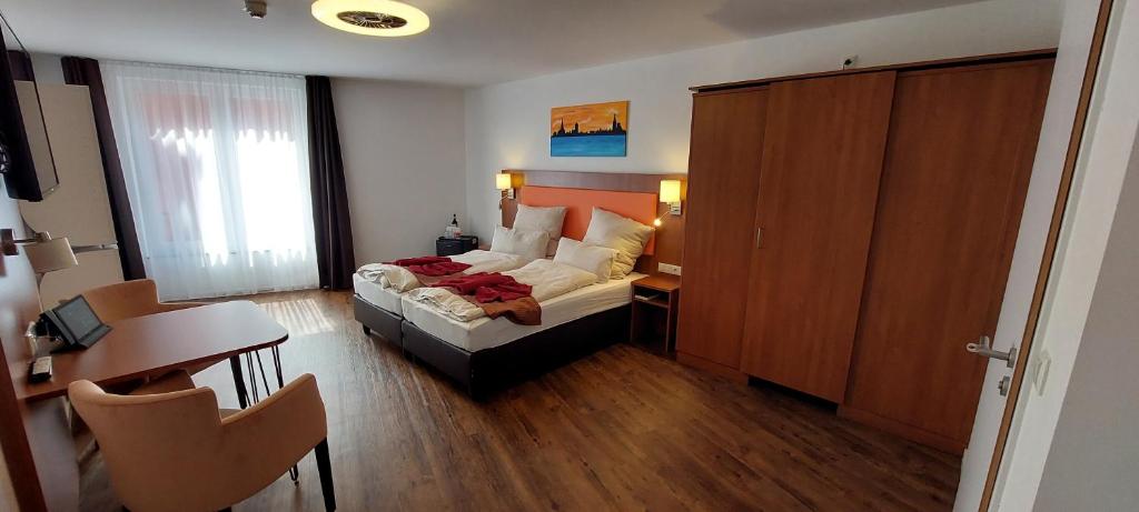 Postel nebo postele na pokoji v ubytování Hotel Amber Altstadt