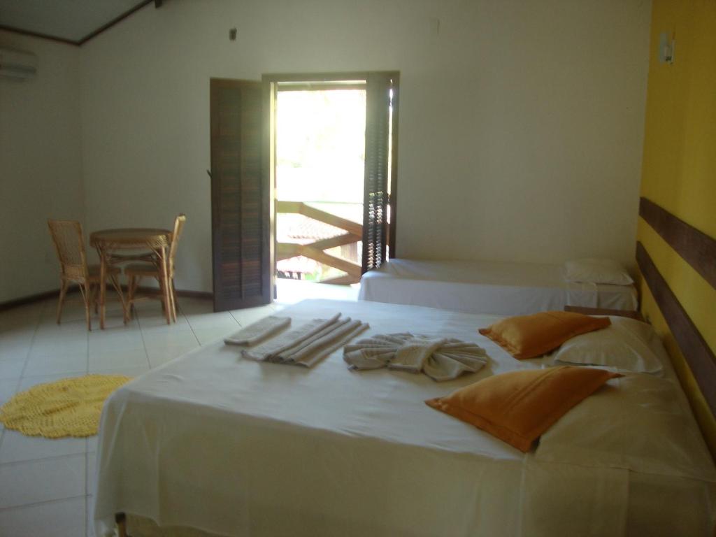 Postel nebo postele na pokoji v ubytování Pousada Flor de Paraty