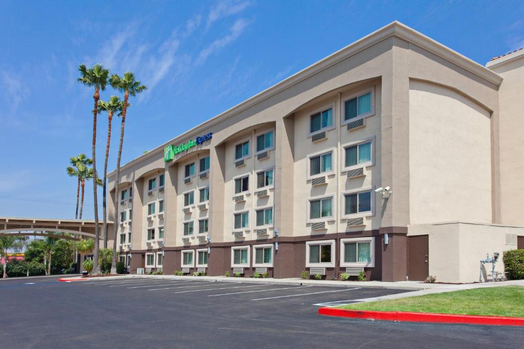 a rendering of a hotel with a parking lot at Holiday Inn Express Colton, an IHG Hotel in Colton