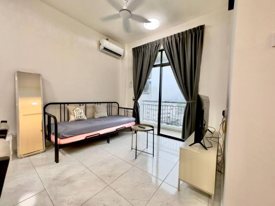 a bedroom with a bed and a window with a balcony at TheSun #BayanLepas#QueensbayMall#PISA#USM in Bayan Lepas
