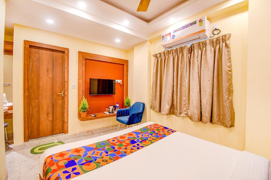 Postel nebo postele na pokoji v ubytování FabHotel Aqua Tulip - Nr Milan Mela