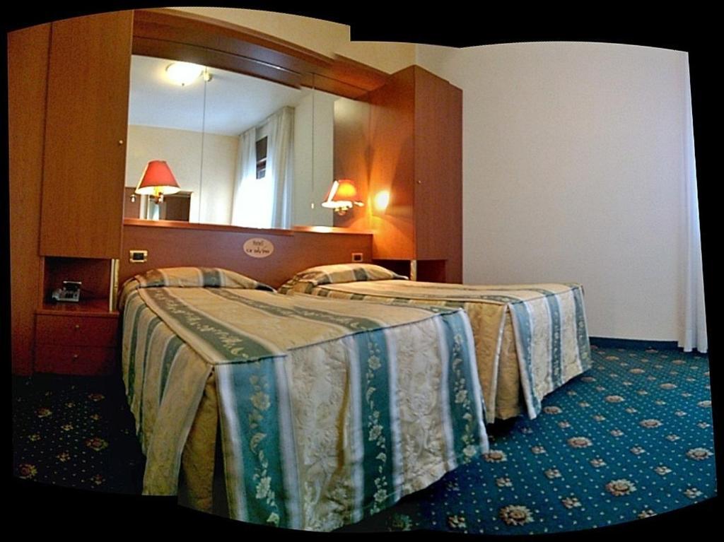Postel nebo postele na pokoji v ubytování Hotel Green castellani