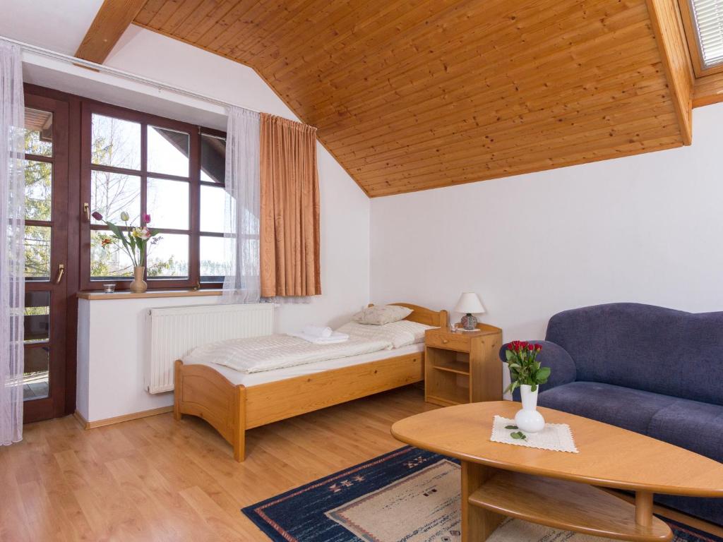 A bed or beds in a room at Villa Tatry Stola