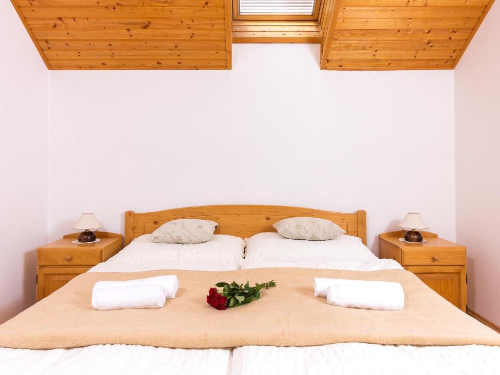 A bed or beds in a room at Villa Tatry Stola