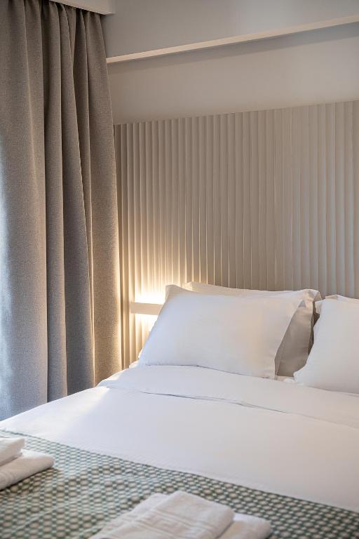 A bed or beds in a room at Casa D'Irene Apts