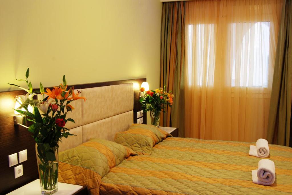 Postel nebo postele na pokoji v ubytování Majestic Hotel & Spa
