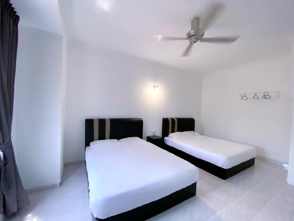 Voodi või voodid majutusasutuse Venice Guest Hostel - Bilik Sahaja toas